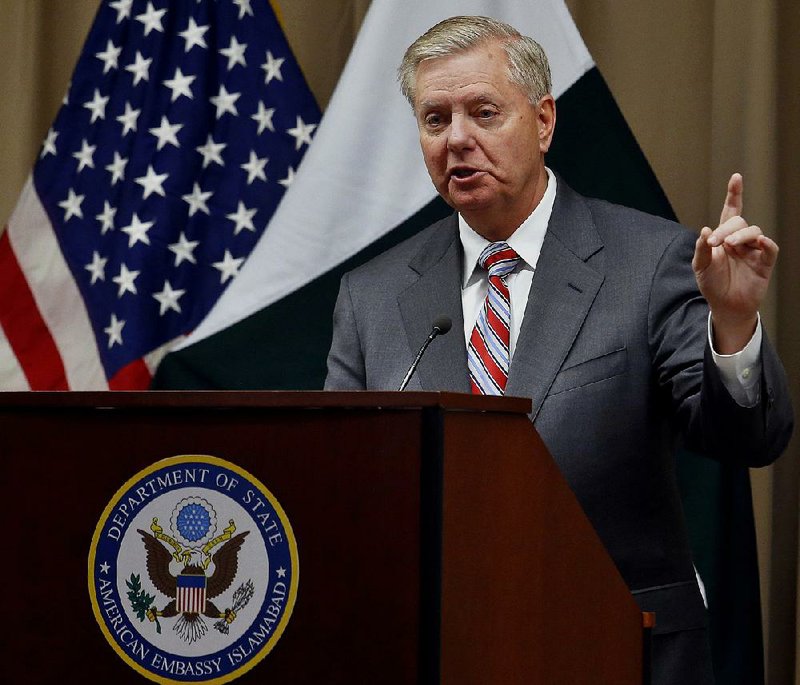 Sen. Lindsey Graham, R-S.C., speaks during a news conference Sunday after his meeting with Pakistani Prime Minister Imran Khan in Islamabad. Graham said he will urge President Donald Trump to meet with Pakistani and Afghan leaders to work out a plan for ending the war in Afghanistan.