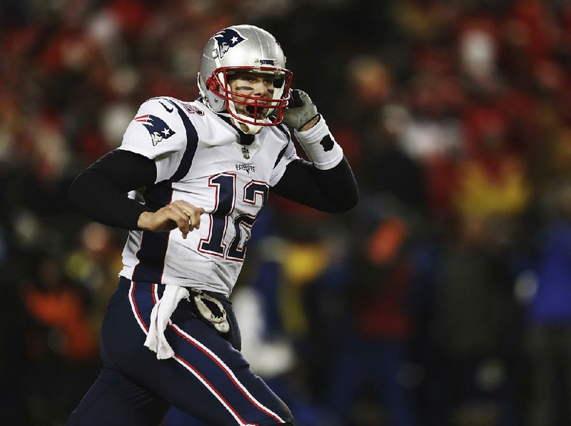 New England quarterback Tom Brady celebrates after the Patriots defeated the Kansas City Chiefs 37-31 in overtime in the AFC Championship Game on Sunday in Kansas City, Mo.