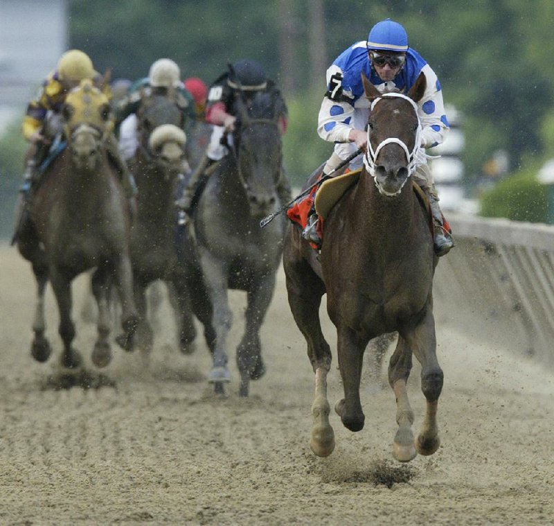 Stewart Elliott rides Smarty Jones to win the Preakness on May 15, 2004, in Baltimore. Elliott is returning to Oaklawn Park as a full-time jockey for the first time since 2006.