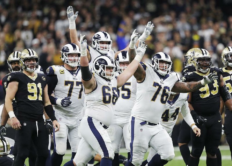 Los Angeles Rams players rejoice after Greg Zuerlein’s 57-yard field goal went through the uprights in overtime for a 26-23 victory in the NFC Championship Game on Sunday in New Orleans. The Rams will meet the New England Patriots in Super Bowl LIII on Feb. 3 at Mercedes-Benz Stadium in Atlanta.