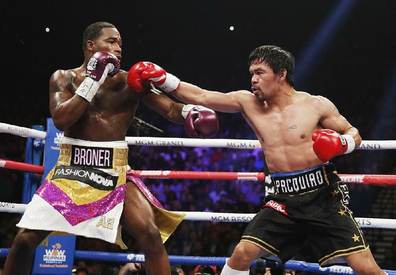 Manny Pacquiao (right) defeated Adrien Broner in a 12-round decision in a welterweight championship match Saturday night in Las Vegas.