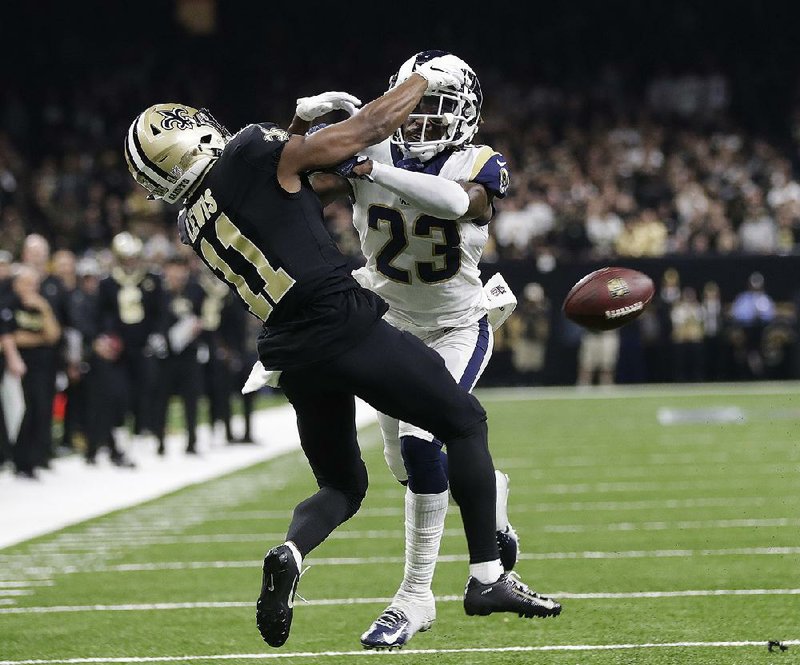 Los Angeles Rams’ Nickell Robey-Coleman breaks up a pass intended for New Orleans Saints’ Tommylee Lewis during the fourth quarter of the NFC Championship Game on Sunday in New Orleans. NFL officials told Saints Coach Sean Payton a pass interference call was missed on the play.