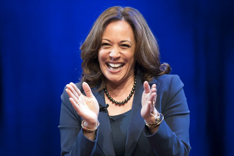 In this Jan. 9, 2019 photo, Sen. Kamala Harris, D-Calif., greets the audience at George Washington University in Washington, during an event kicking off her book tour. Harris, a first-term senator and former California attorney general known for her rigorous questioning of President Donald Trump's nominees, entered the Democratic presidential race on Monday. (AP Photo/Sait Serkan Gurbuz)
