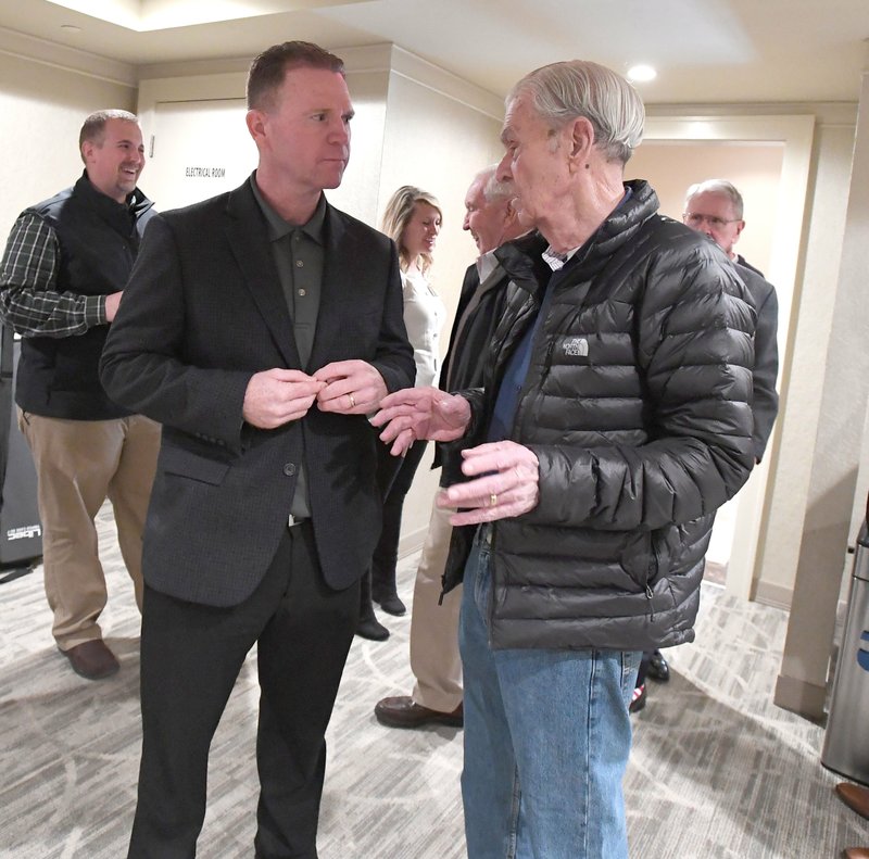 NWA Naturals owner David Glass (RIGHT) visits with new Naturals manager Darryl Kennedy Monday Jan. 21, 2019 at the annual Hot Stove Luncheon.