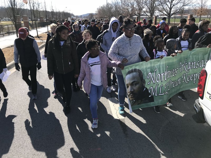 Marchers during the Martin Luther King Jr. parade, Monday, Jan. 21, 2019 in Fayetteville. 