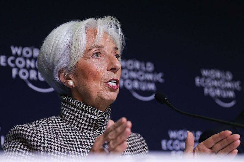 International Monetary Fund Managing Director Christine Lagarde briefs reporters during a news conference at the annual meeting of the World Economic Forum on Monday in Davos, Switzerland. 