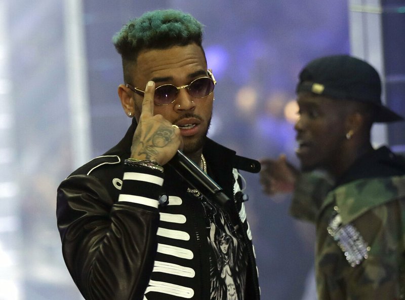 In this Sept.21, 2018 file photo, singer Chris Brown performs during Philipp Plein's women's 2019 Spring-Summer collection, unveiled during the Fashion Week in Milan, Italy. 