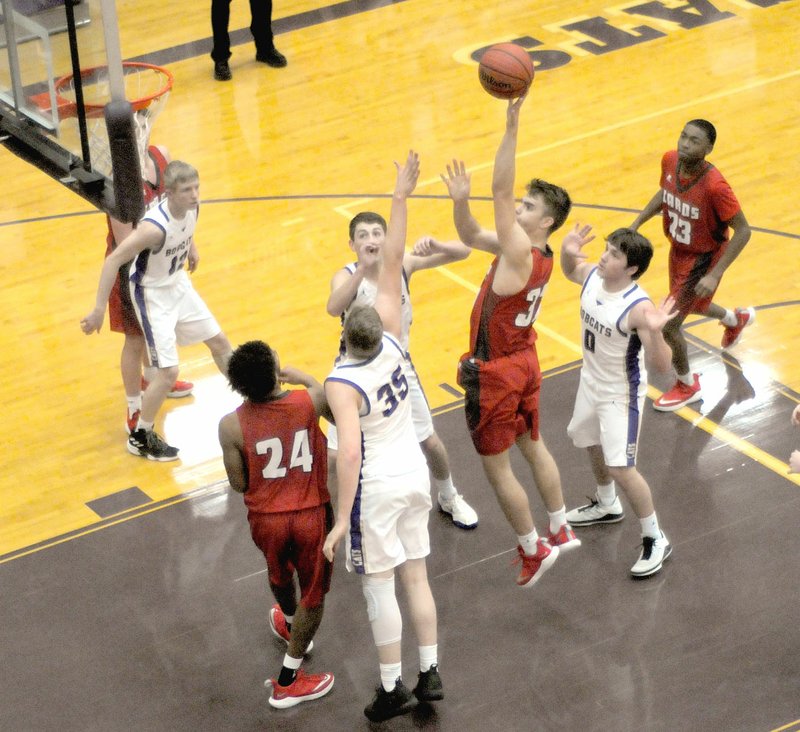 MARK HUMPHREY ENTERPRISE-LEADER Farmington senior Will Pridmore scores two of his game-high 28 points during the Cardinals' 67-53 win on Tuesday, Jan. 15, 2019, at Berryville's Bobcat Arena.