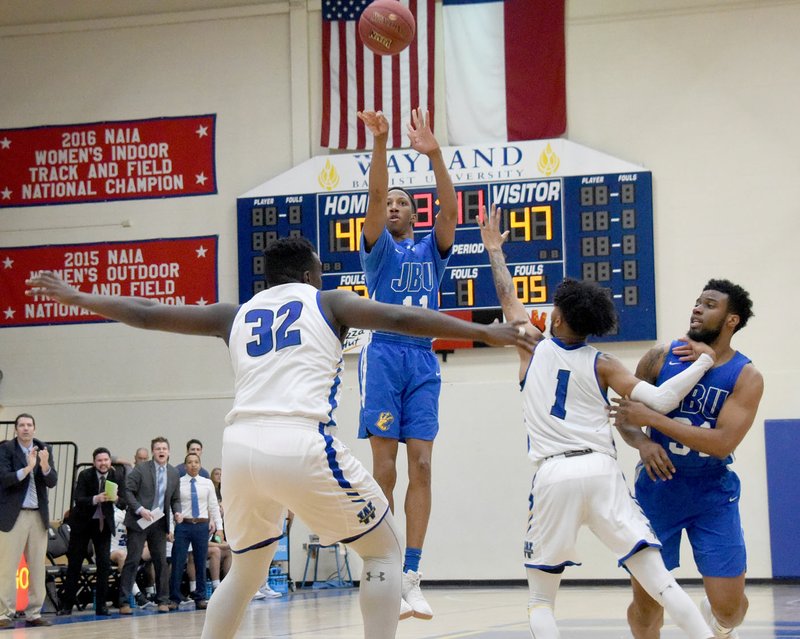 Photo courtesy of Wayland Baptist John Brown freshman Desmond Kennedy takes a shot during the second half of Saturday's game at Wayland Baptist in Plainview, Texas. JBU defeated the Pioneers 73-72.