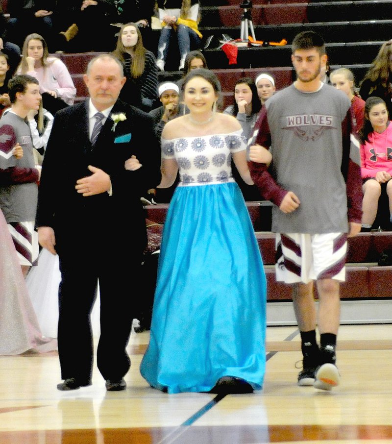 MARK HUMPHREY ENTERPRISE-LEADER Junior maid Gracee Stout, daughter of Chris and Lisa Stout, escorted by her father and junior Cole Griscom, son of Curtis and Becki Griscom.