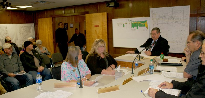 Hunter McFerrin/Herald-Leader The city attorney of West Siloam Springs, Jot Hartley, reads a letter that the former town manager, Kathy Osbourn, submitted to him and Mayor Elaine Carr on Monday afternoon, notifying them that she would not be attending. Osbourn is facing allegations of misusing about $150,000 of city funds for personal expenses and was expected to appear with her attorney to confront them during a board of trustees meeting on Monday night. Pictured, (from left) is City Office Clerk Rainbow Cash, newly appointed City Office Manager Kerri Loudermilk, Hartley, Vice Mayor Larry Williams and Board Member Stephen Roberts.