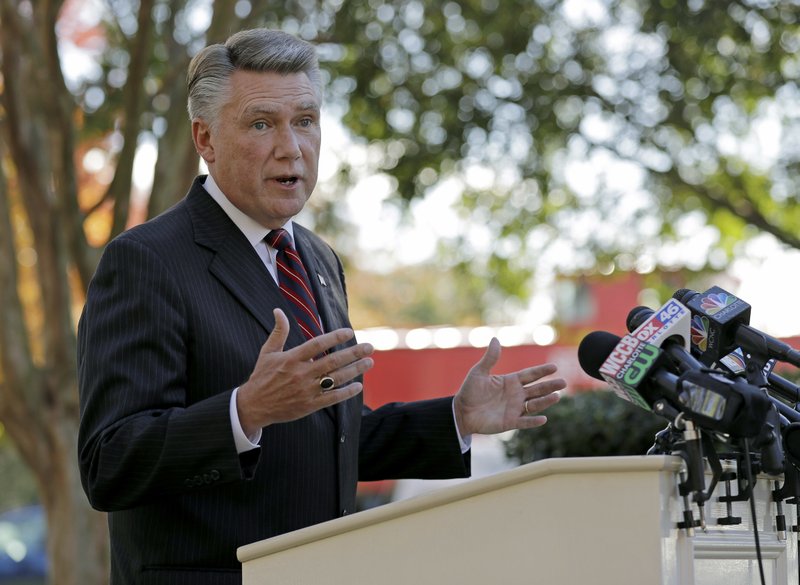 In this Nov. 7, 2018 file photo Republican Mark Harris speaks to the media during a news conference in Matthews, N.C.