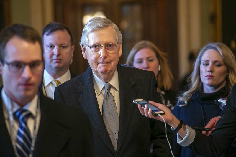 Senate Majority Leader Mitch McConnell, R-Ky., leaves the chamber after speaking about his plan to move a 1,300-page spending measure, which includes $5.7 billion to fund President Donald Trump's proposed wall along the U.S.-Mexico border, the sticking point in the standoff between Trump and Democrats that has led to a partial government shutdown, at the Capitol in Washington, Tuesday, Jan. 22, 2019. (AP Photo/J. Scott Applewhite)