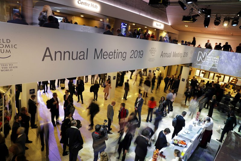 People attend the annual meeting of the World Economic Forum in Davos, Switzerland, Wednesday, Jan. 23, 2019. (AP Photo/Markus Schreiber)