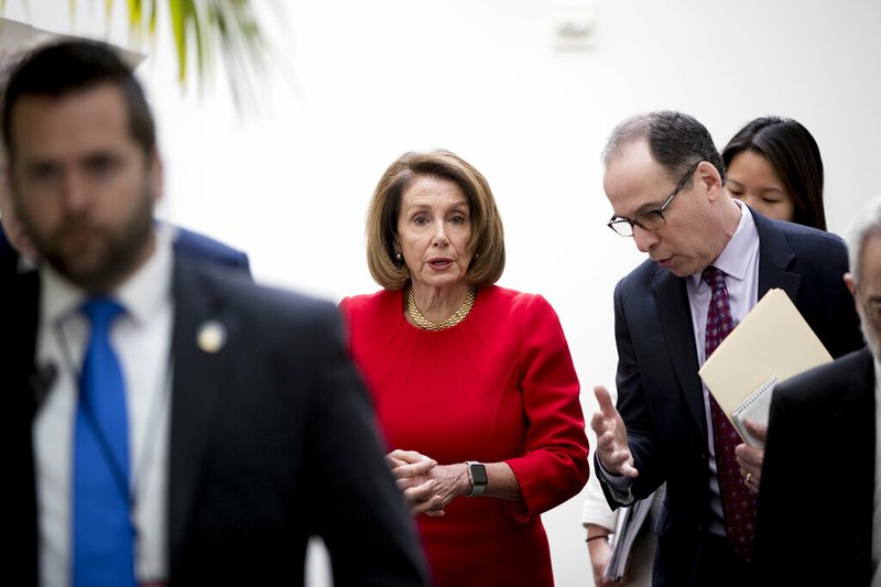 House Speaker Nancy Pelosi of Calif. leaves a House Democratic Caucus meeting on Capitol Hill in Washington, Wednesday, Jan. 23, 2019. (AP Photo/Andrew Harnik)