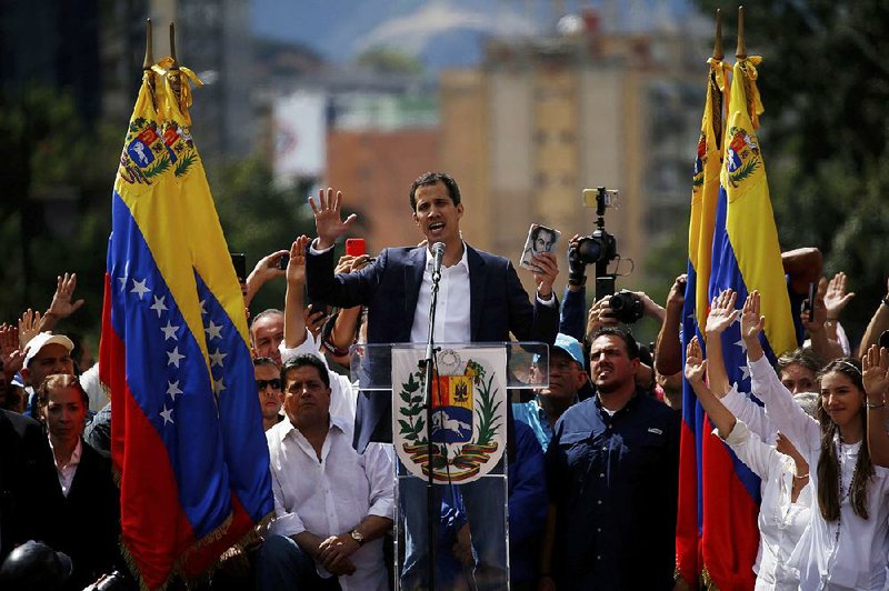 Juan Guaido, the leader of the Venezuelan National Assembly, declares himself interim president at a rally Wednesday in Caracas. The United States then announced its backing of Guaido. 