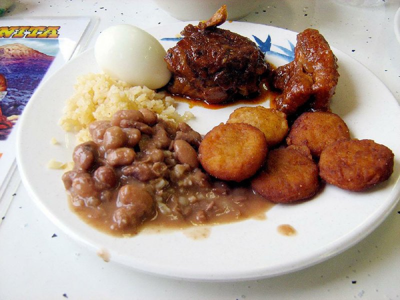 A plate of beans, rice, chicken nuggets, a rib, a chicken thigh and a boiled egg are among the items available with the buffet option at La Poblanita.