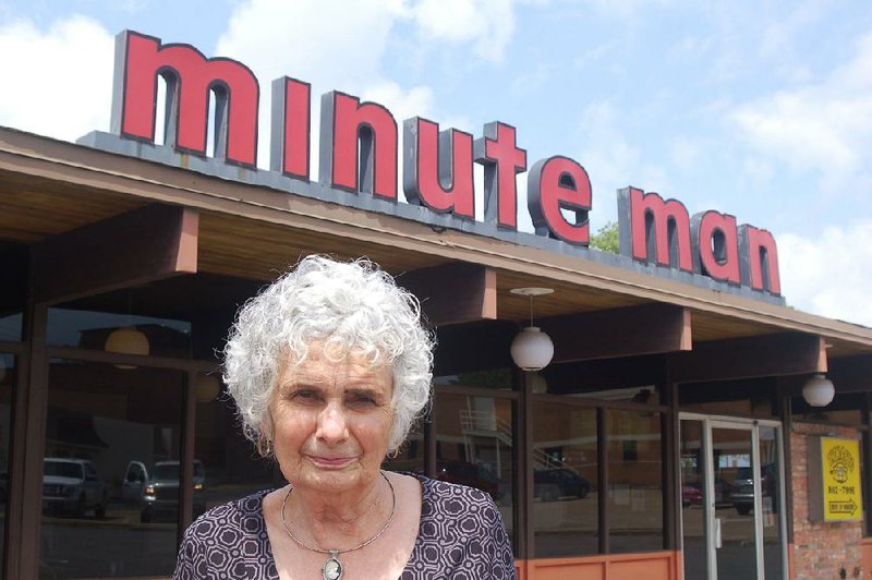 Linda McGoogan stands outside the “last Minute Man” standing in May as the restaurant marked the 70th anniversary of its 1948 founding. McGoogan and Arkansas native Perry J. Smith have formed a partnership with the goal of resurrecting the char-grilled burger chain. 