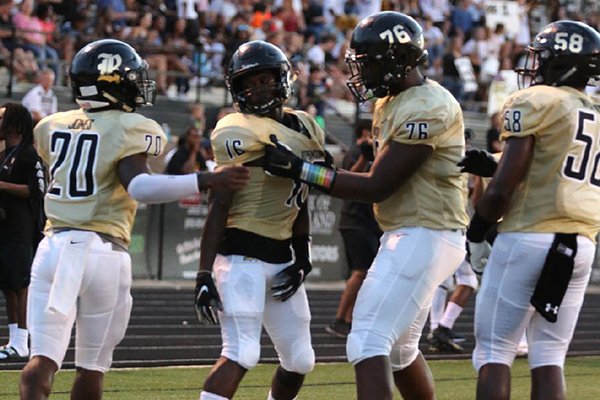 Robinson's Mekel Kentle (16) is congratulated by offensive lineman E'Marion Harris (76) after a touchdown in the second quarter of Robinson's 35-14 win over Rogers on Friday, Aug. 31, 2018, at Charlie George Stadium in Little Rock. 