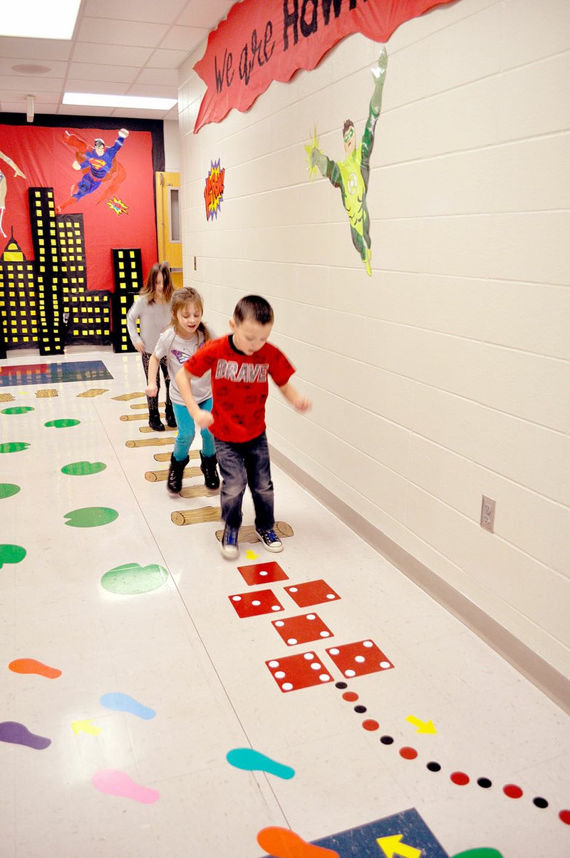 RACHEL DICKERSON/MCDONALD COUNTY PRESS JJ Vega (front to back), Autumn Moody and Ruby Frazier enjoy the new sensory hallway at Pineville Primary School.