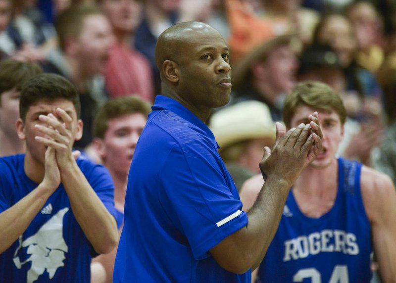 NWA Democrat-Gazette/CHARLIE KAIJO Rogers High School head coach Lamont Frazier watches his players during a basketball game, Friday, January 25, 2019 at War Eagle Arena at Rogers Heritage High School in Rogers.