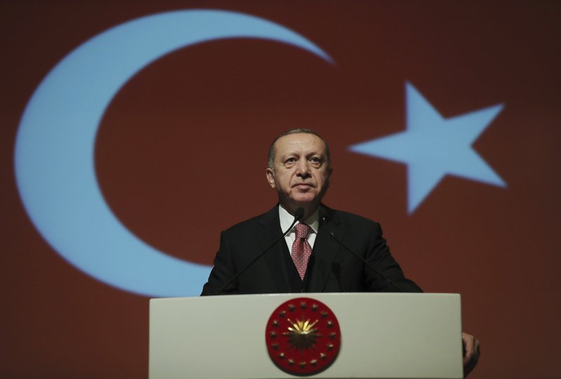 Turkey's President Recep Tayyip Erdogan delivers a speech during a military academy ceremony in Ankara, Turkey, Thursday Jan. 24, 2019. Erdogan says he is shocked by U.S. President Donald Trump's decision to recognise Venezuelan opposition leader Juan Guaido's claim to the presidency.(Presidential Press Service via AP, Pool)