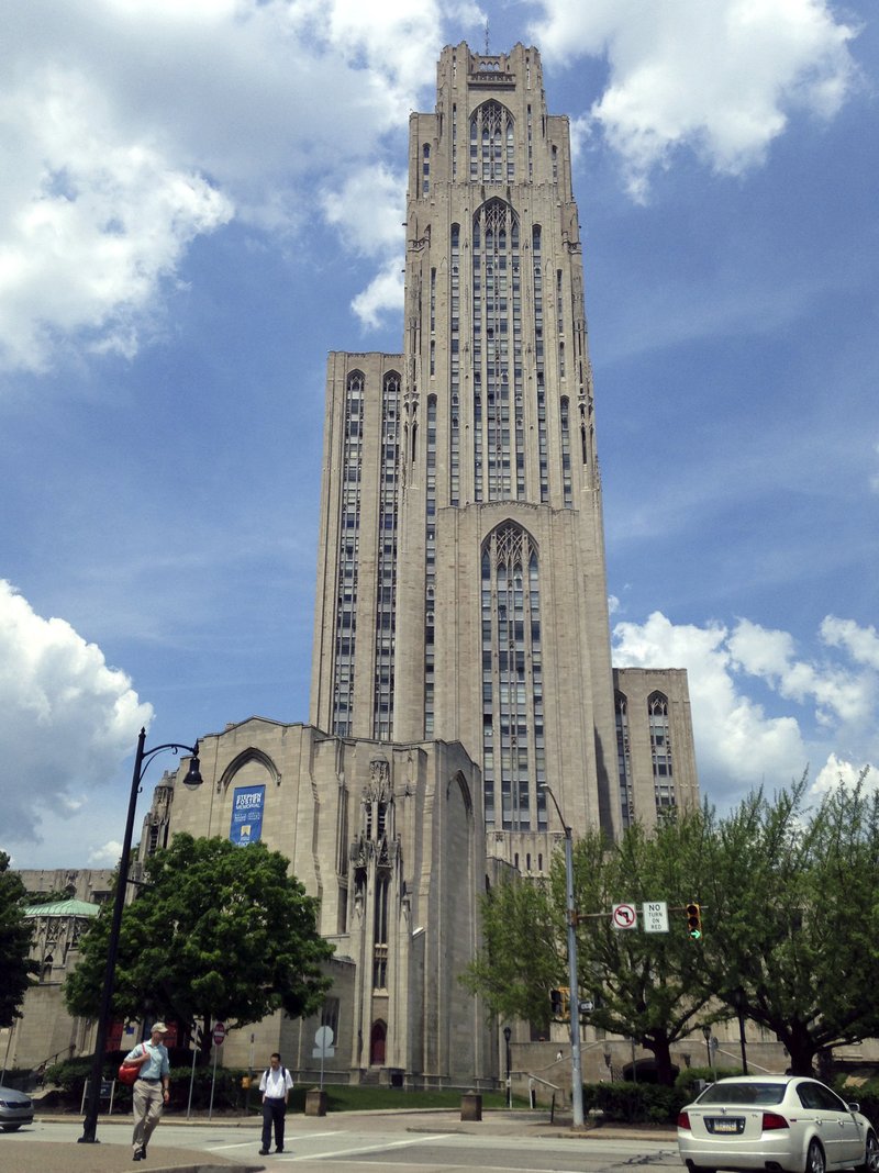 In this May 31, 2016, file photo the Cathedral of Learning, a landmark listed in the National Register of Historic Places, stands on the University of Pittsburgh's main campus in Pittsburgh. The University of Pittsburgh is offering graduating seniors up to $5,000 in federal student loan relief with one request: They pay it forward. The school’s new program, Panthers Forward, will help recent graduates chip away at student debt and introduce them to alumni mentors to encourage professional development. Students have no obligation to repay the gift, but the university is encouraging recipients to make financial contributions to sustain the program. (AP Photo/Bill Sikes, File)

