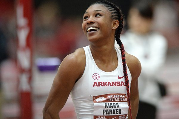 Arkansas' Kiara Parker smiles Saturday, Jan. 26, 2019, as she sees her time in the finals of the 60 meters during the Razorback Invitational in the Randal Tyson Track Center in Fayetteville.