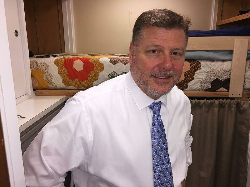FILE — U.S. Rep. Rick Crawford stands inside his tiny bunking room in his Capitol Hill office.