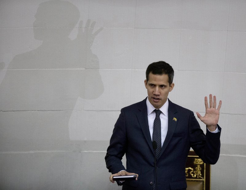 FILE - In this Jan. 5, 2019, file photo, Venezuelan lawmaker Juan Guaido takes the oath of office as president of the National Assembly in Caracas, Venezuela. A coalition of Latin American governments that joined the U.S. in quickly recognizing Guaido as Venezuela&#x2019;s interim president, and not Nicolas Maduro, came together during weeks of secret diplomacy. (AP Photo/Fernando Llano, File)