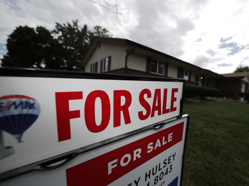 In this Oct 2, 2018, file photo, a for sale sign stands outside a home on the market in the north Denver suburb of Thornton, Colo.  (AP Photo/David Zalubowski, File)