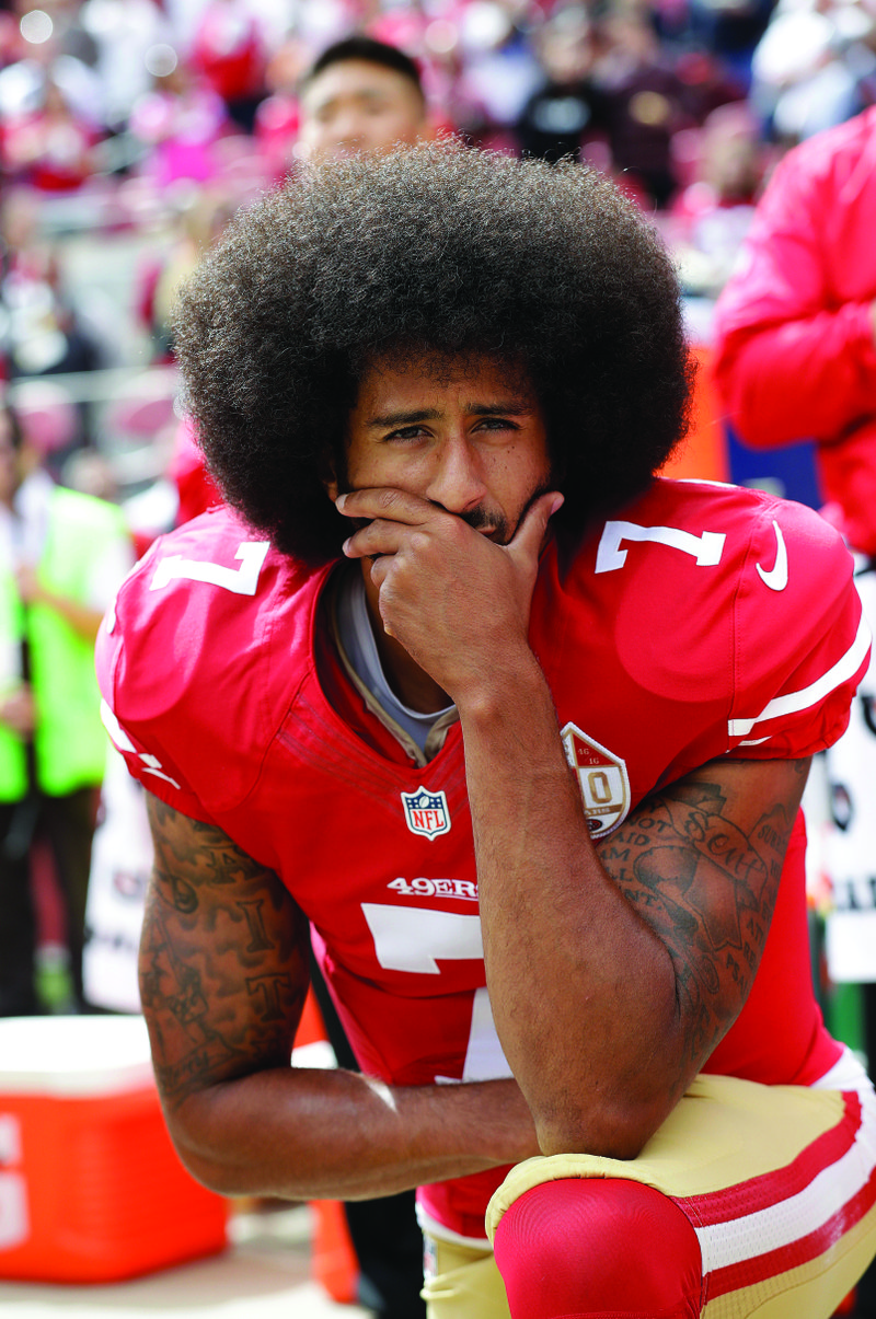 In this Oct. 2, 2016, file photo, then-San Francisco 49ers quarterback Colin Kaepernick kneels during the national anthem before an NFL football game against the Dallas Cowboys, in Santa Clara, Calif. Ex-NFL player Colin Kaepernick helped start a wave of protests by kneeling during the national anthem to raise awareness to police brutality, racial inequality and other social issues. Big-name entertainers believe social injustice needs to be addressed during the Super Bowl and are ensuring the topic that ignited a political firestorm and engulfed the NFL will be in the spotlight. (AP Photo/Marcio Jose Sanchez, File)