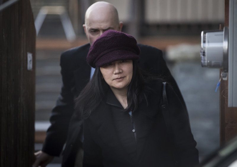 Huawei chief financial officer Meng Wanzhou, who is out on bail and remains under partial house arrest after she was detained Dec. 1 at the behest of American authorities, leaves her home to attend a court appearance regarding her bail conditions, in Vancouver, British Columbia, Tuesday Jan. 29, 2019. 