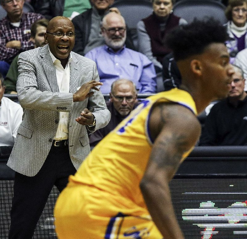 UALR head coach Darrell Walker calls out a play during their game against Southeastern Oklahoman State at the Jack Stephens Center in Little Rock Thursday, Nov 8, 2018.