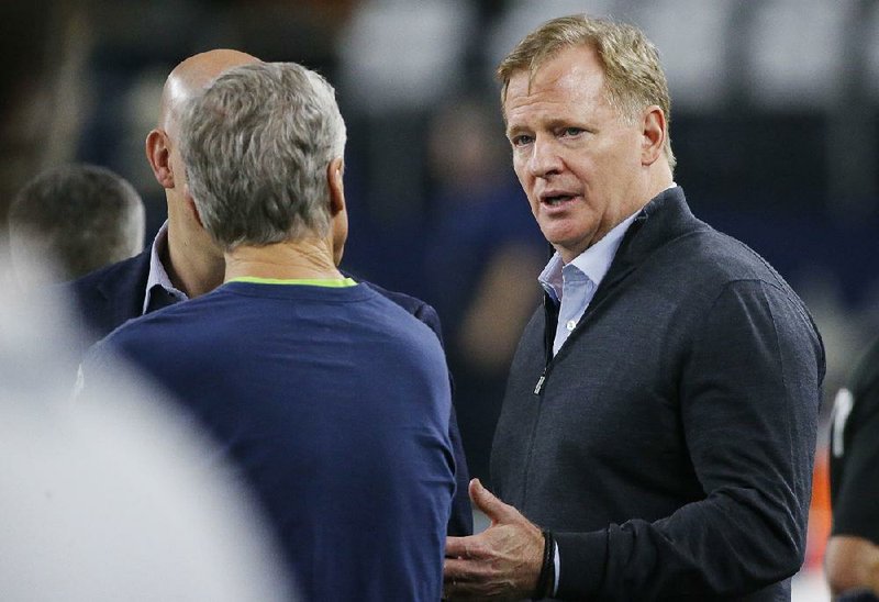 NFL Commissioner Roger Goodell (right) speaks with Seattle Seahawks head coach Pete Carroll before a NFC wild-card NFL football game between the Dallas Cowboys and the Seattle Seahawks in Arlington, Texas, Saturday, Jan. 5, 2019. 