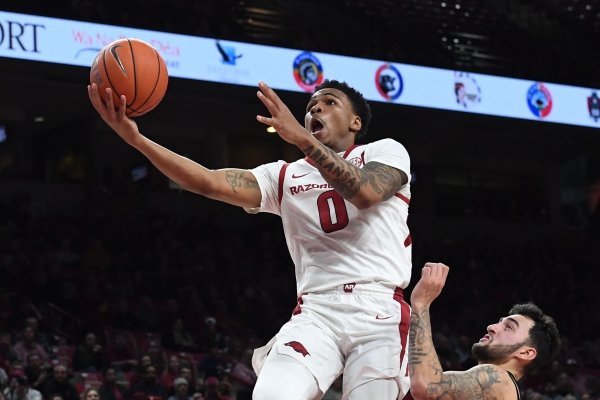 Arkansas' Desi Sills makes a shot over Missouri's Jordan Geist Wednesday Jan. 23, 2019 at Bud Walton Arena in Fayetteville. Arkansas won 72-60.