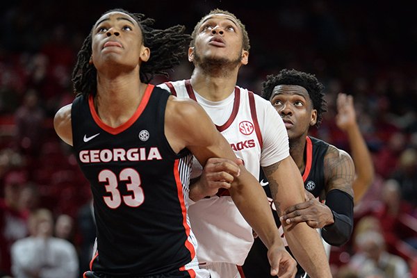 Arkansas forward Daniel Gafford (10) looks to rebound against Georgia forward Nicolas Claxton (33) on Tuesday, Jan. 29, 2019, in Fayetteville.