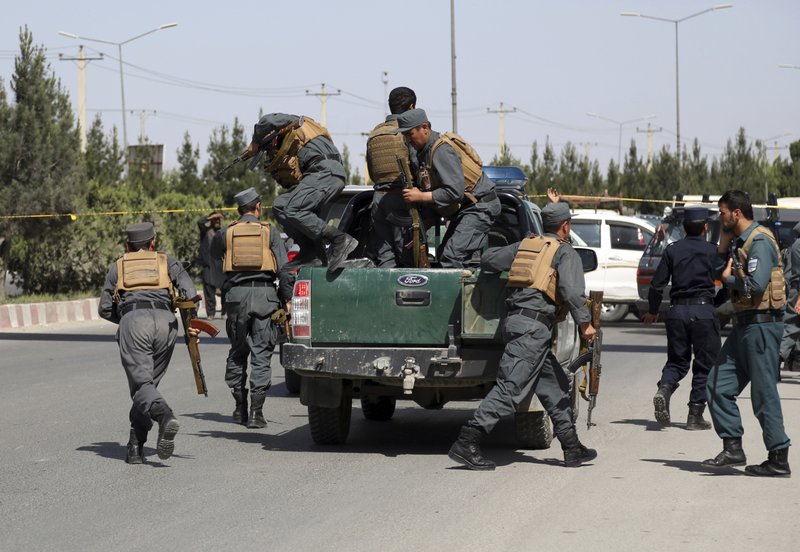  In this May 30, 2018, file photo, Afghan Security personnel arrive at the site of deadly attack on the interior ministry, in Kabul, Afghanistan. As the Trump administration pushes for peace in Afghanistan, a new U.S. watchdog report says Afghan security forces are shrinking, gaps in security are growing, and the Taliban are largely holding their own despite a surge in American bombing. (AP Photo/Rahmat Gul, File)