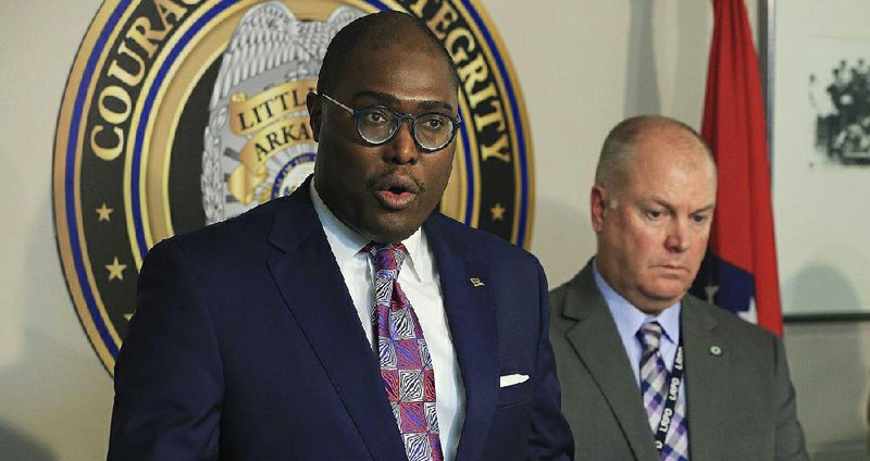 Mayor Frank Scott, Jr., left, along with Interim Little RocK Police Chief Wayne Bewley speaks Wednesday during a press conference at Little Rock Police Department Headquarters about January homicides. 