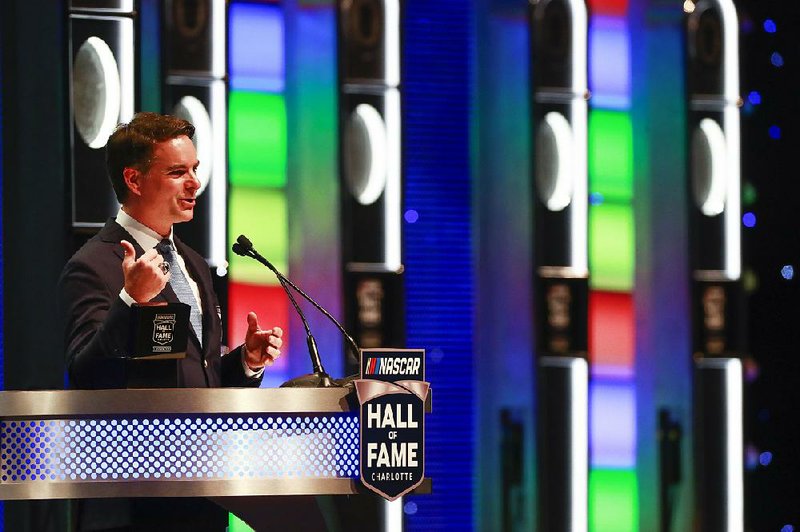 Jeff Gordon speaks during Friday’s NASCAR Hall of Fame induction ceremony in Charlotte, N.C. Also included were the late drivers Davey Allison and Alan Kulwicki, as well as team owners Roger Penske and Jack Roush.