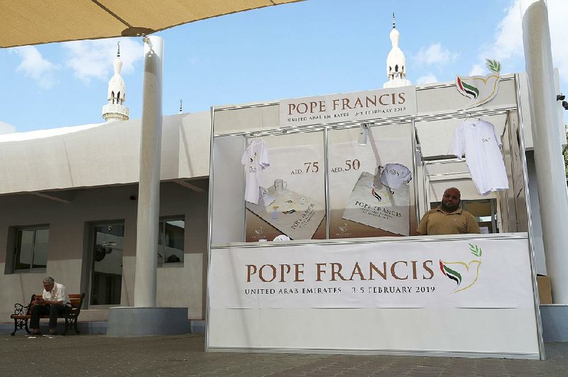 A man at St. Mary’s Catholic Church in Dubai, United Arab Emirates, sells memorabilia last month for Pope Francis’ visit, which  starts today. 