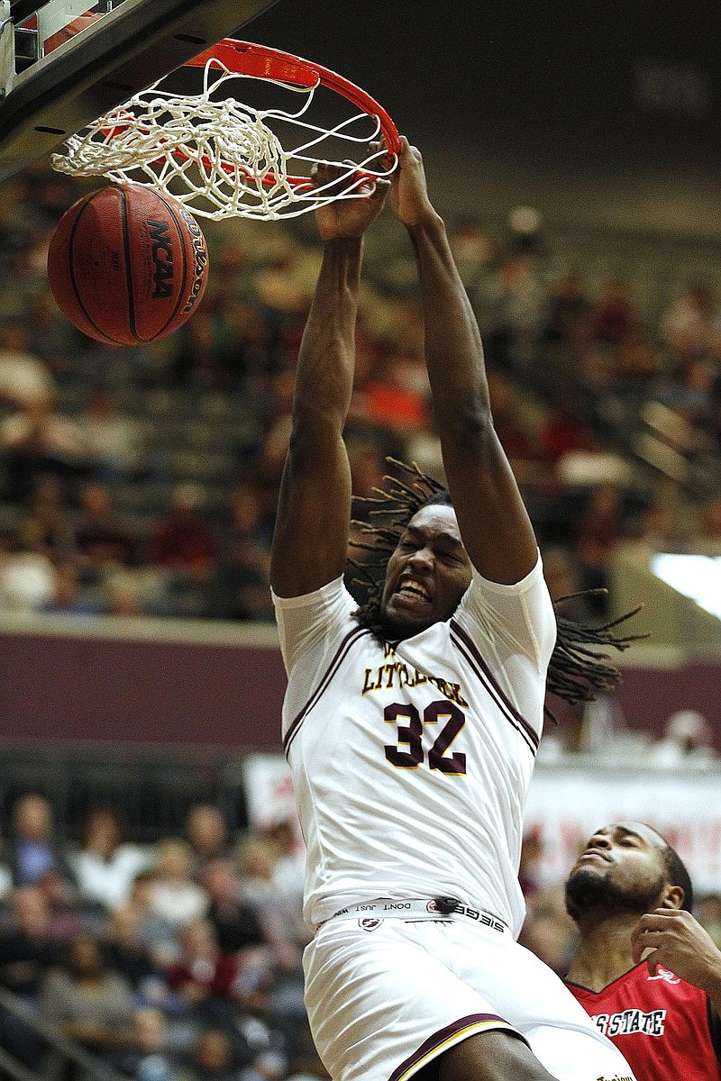 UALR’s Kris Bankston dunks during the second half of the Trojans’ 84-83 loss to Arkansas State on Saturday at the Jack Stephens Center in Little Rock. Bankston had 15 points as one of four Trojans in double figures. 