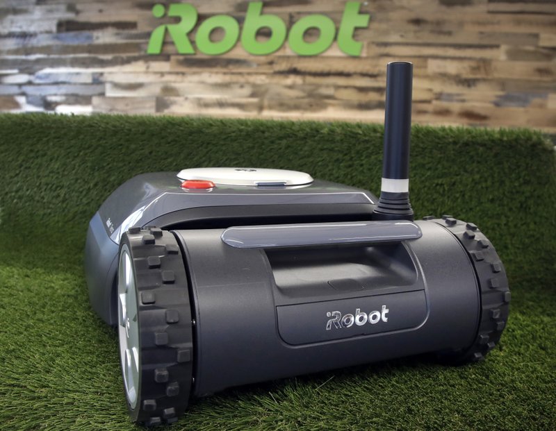This Wednesday, Jan. 16, 2019 photo shows an iRobot Terra lawn mower in Bedford, Mass. Building a robot lawn mower seemed the logical next step for iRobot, which invented the pioneering robotic vacuum Roomba. But the company&#x2019;s secret, decade-plus lawn mower project was a lot harder than anyone expected. (AP Photo/Elise Amendola)