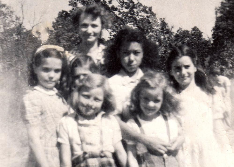 Laverne Cook stands in front of Lower Whorton Creek School teacher Blenda Mathis with her arms around Barbara Fowler, now Barbara Robertson, in a school photo taken in the fall of 1948. 