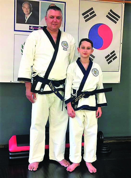 El Dorado Fire Chief Chad Mosby and his son Carson practice Soo Bahk Do, a Korean martial art. 