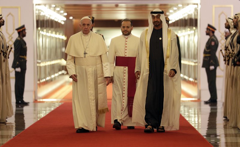 Pope Francis is welcomed by Abu Dhabi's Crown Prince Sheikh Mohammed bin Zayed Al Nahyan, upon his arrival at the Abu Dhabi airport, United Arab Emirates, Sunday, Feb. 3, 2019. Francis travelled to Abu Dhabi to participate in a conference on interreligious dialogue sponsored the Emirates-based Muslim Council of Elders, an initiative that seeks to counter religious fanaticism by promoting a moderate brand of Islam. (AP Photo/Andrew Medichini, Pool)