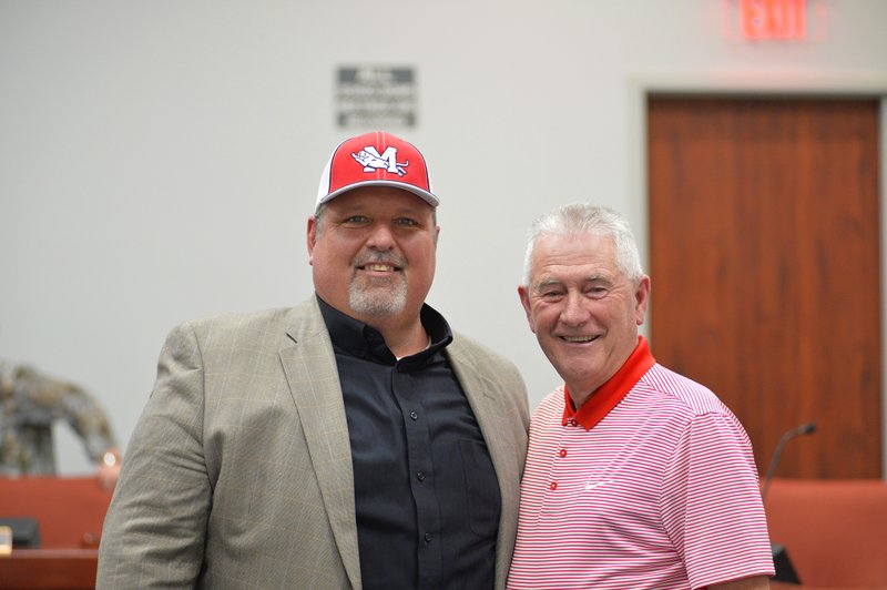 New Panther Head Football Coach Mark King (left) with Magnolia Athletic Director Marvin Lindsey on Monday, after the coach was approved for hire by the school board.