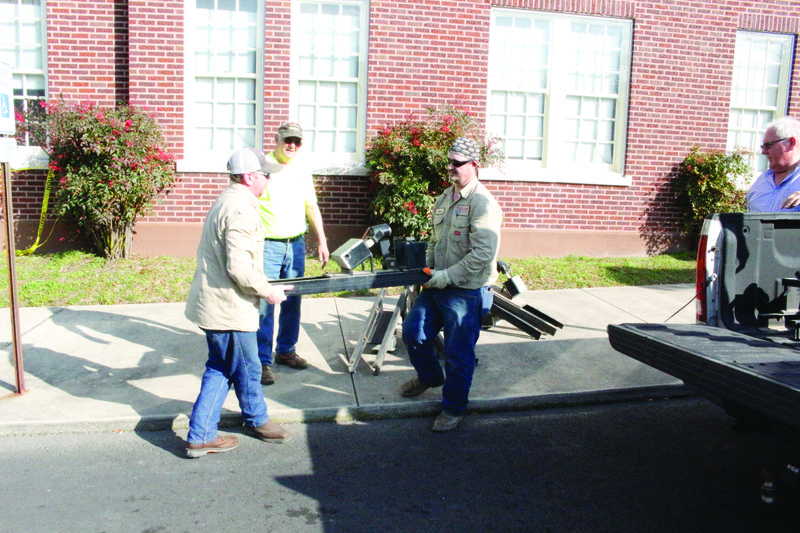 Chime: Workers from Milam Construction load the individual chimes that make up the carillon into their vehicle. Each chime weighs about 550 pounds; in all, the instrument weighs over 8,000 pounds.