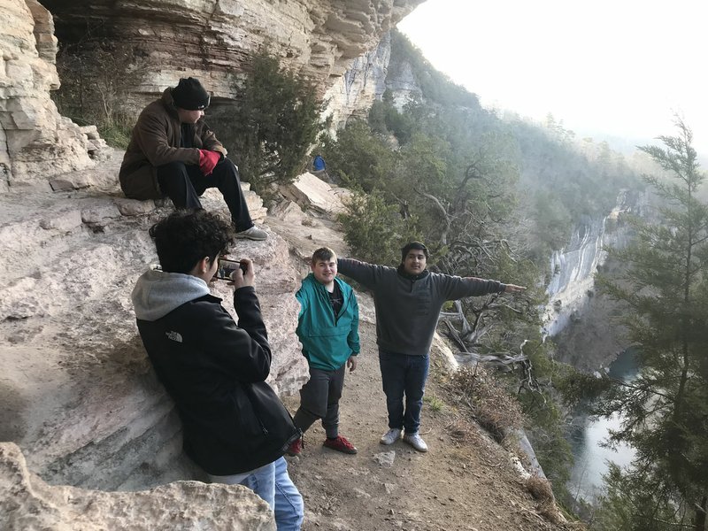 Courtesy photo Student backpackers take in the sights from the Buffalo National River high above the water on the Goat Trail. Gustavo Rodriguez (from left), Sebastian Torres, Courtland Haynes and Jason Martinez explored the bluff.