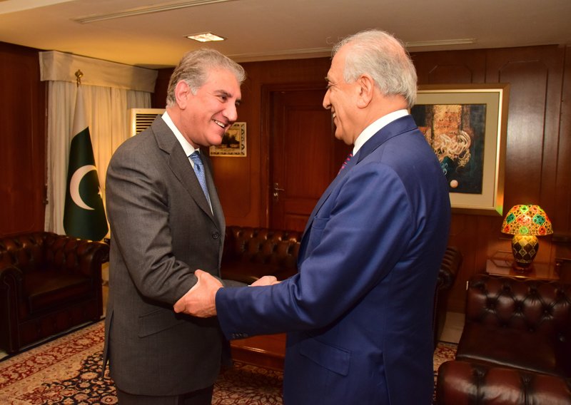 FILE - In this Jan. 18, 2019 file photo, released by the Foreign Office, Pakistan's Foreign Minister Shah Mahmood Qureshi, left, receives U.S. envoy Zalmay Khalilzad at the Foreign Ministry in Islamabad, Pakistan. Khalilzad is in a hurry to find a peace deal for Afghanistan that would allow America to bring home its troops after 17 years of war. The main talks are between Khalilzad and the Taliban&#x2019;s political leadership, which is based in the Gulf nation of Qatar. Khalilzad is meeting with Pakistan, which is widely believed to harbor the Taliban&#x2019;s top leadership, as well as China, India and Russia, which have an interest in stabilizing the region -- and in expanding their influence. (Pakistan Foreign Office, via AP, File)
